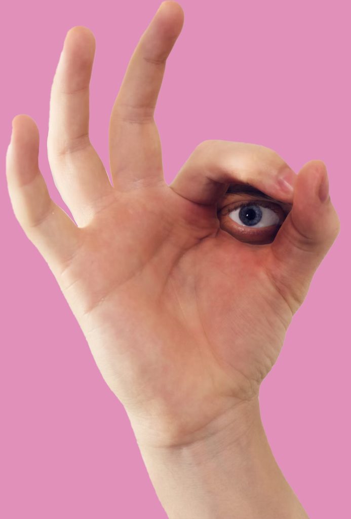 A hand with an eyeball inserted into the space between the thumb and second second finger