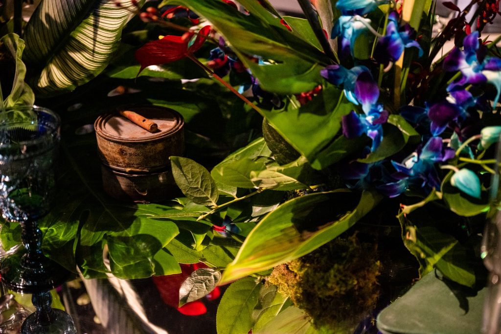 Objects amongst green foliage.