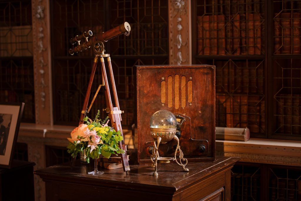 Antique objects displayed on a wooden plinth