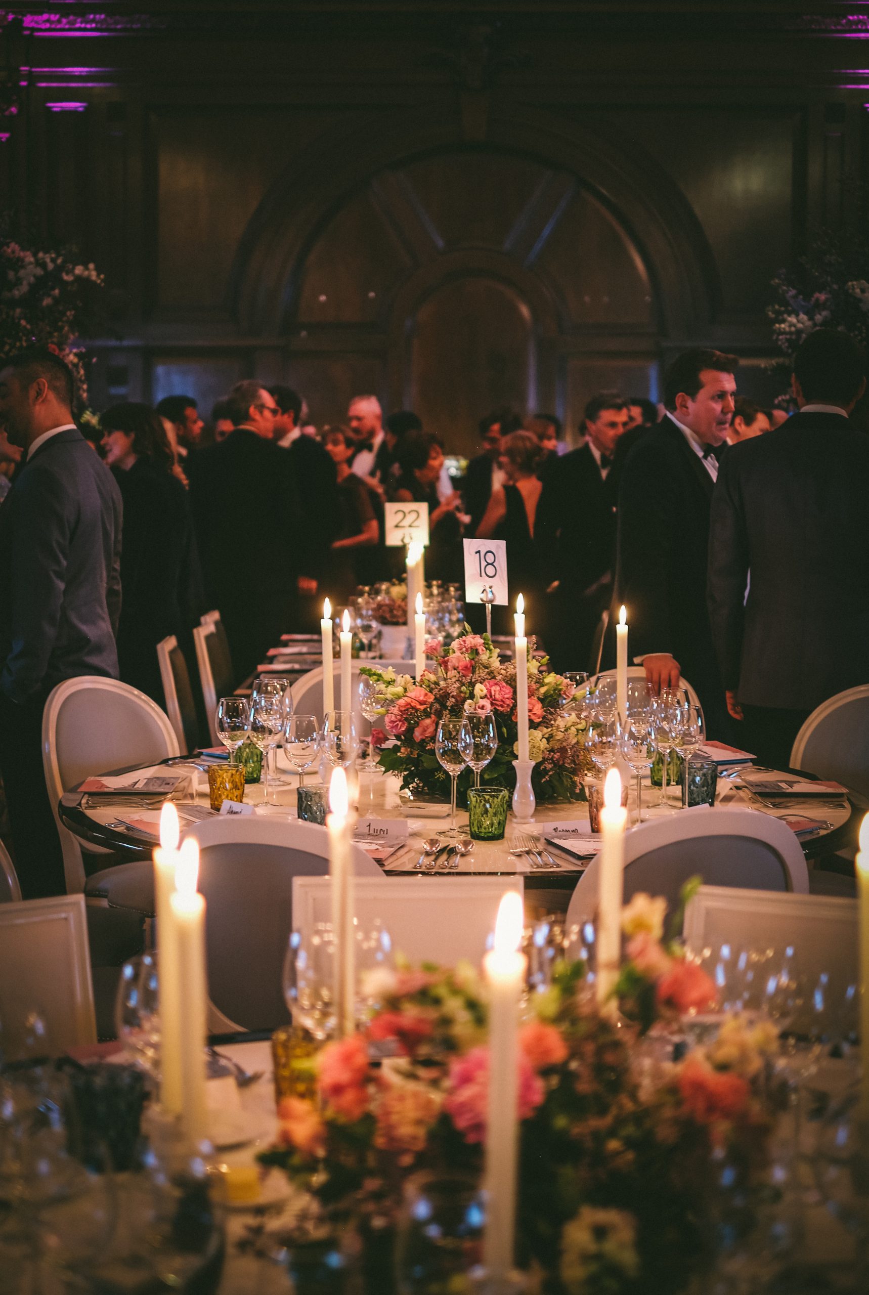 A table set for dinner with flowers and candles.