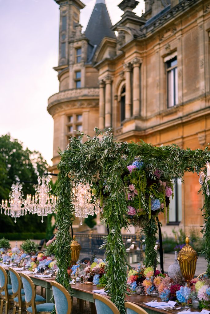 A floral pergola over a dining table set on the Parterre at Waddesdon Manor.